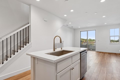 A kitchen with a sink and a window.