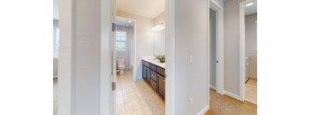 A bathroom with a sink, toilet, and shower.