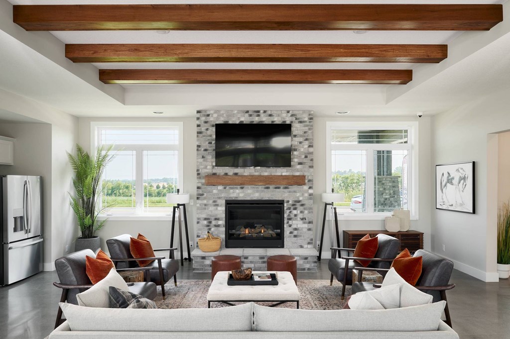 A modern living room with a fireplace and a couch.