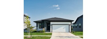 a large house with a driveway and a garage door