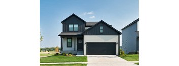 a black and white house with a garage door
