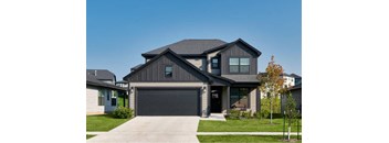a house with a black garage door