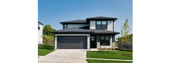 a house with a garage door in front of it