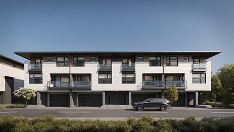 A modern building with a car parked in front.