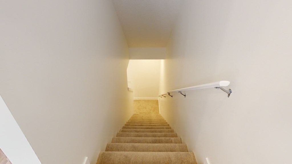A staircase with a light at the top.