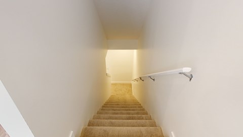 A staircase with a light at the top.