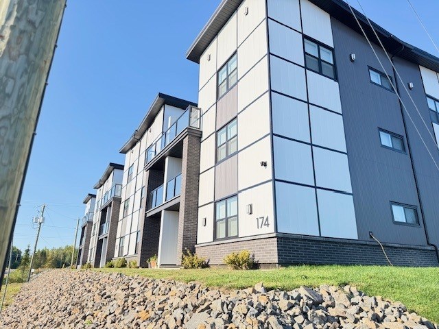 A modern building with the number 174 on it.