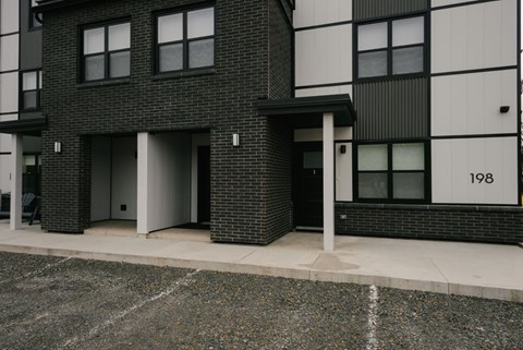 A black and white building with the number 198 on it.