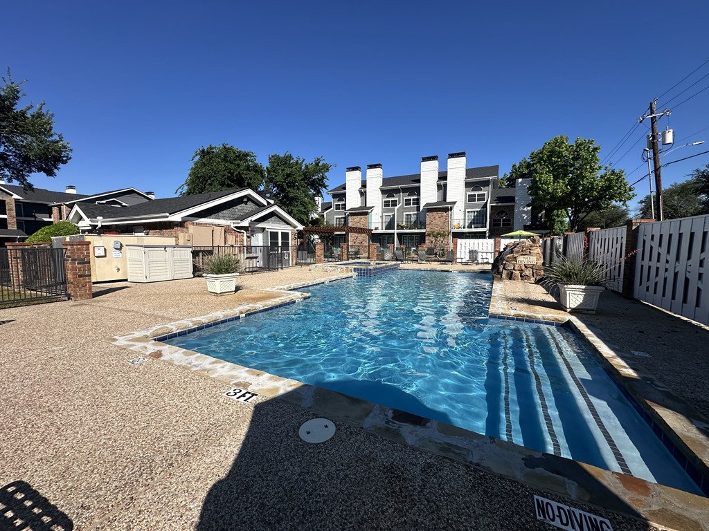 A pool with the words "NO DIVING" written on the ground.