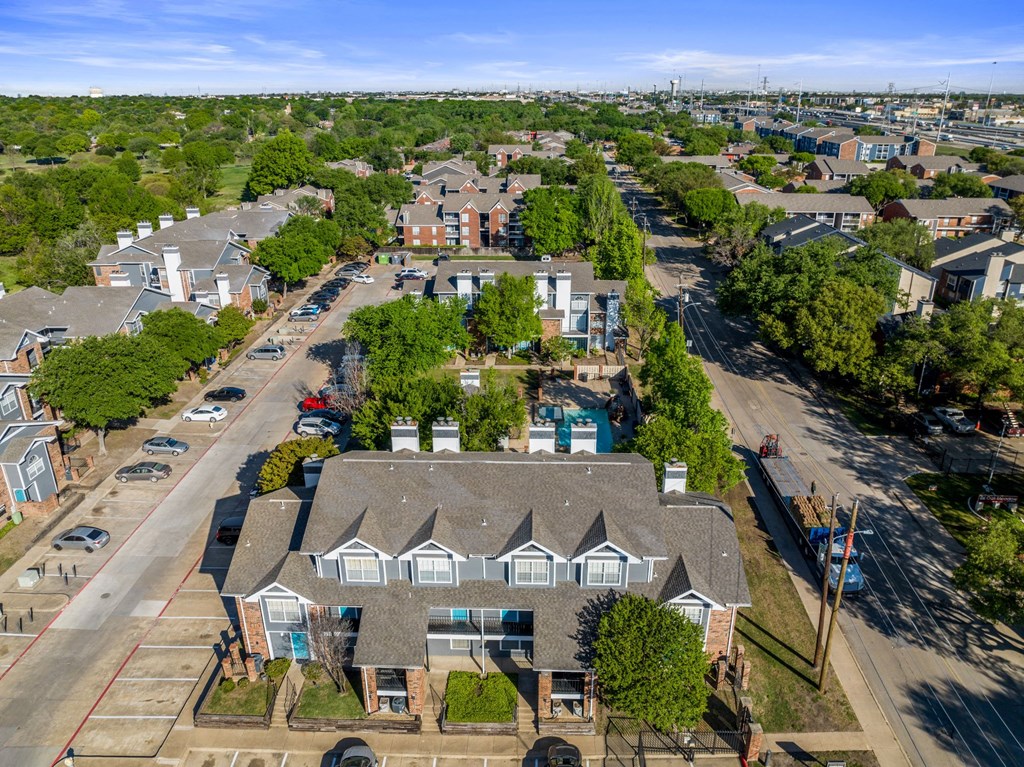 aerial shot of apartment complex trees