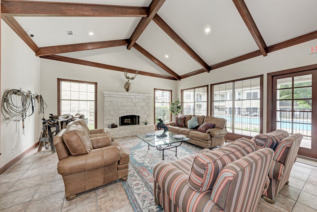 A living room with a statue in the middle of the room.