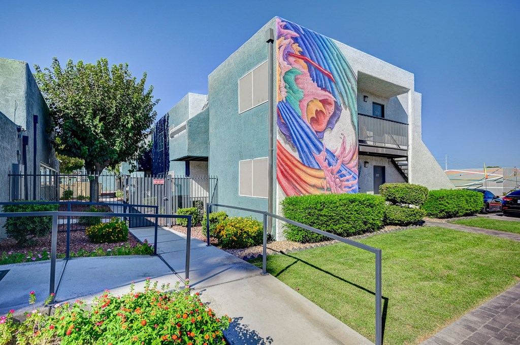 A modern building with a colorful mural on the side.