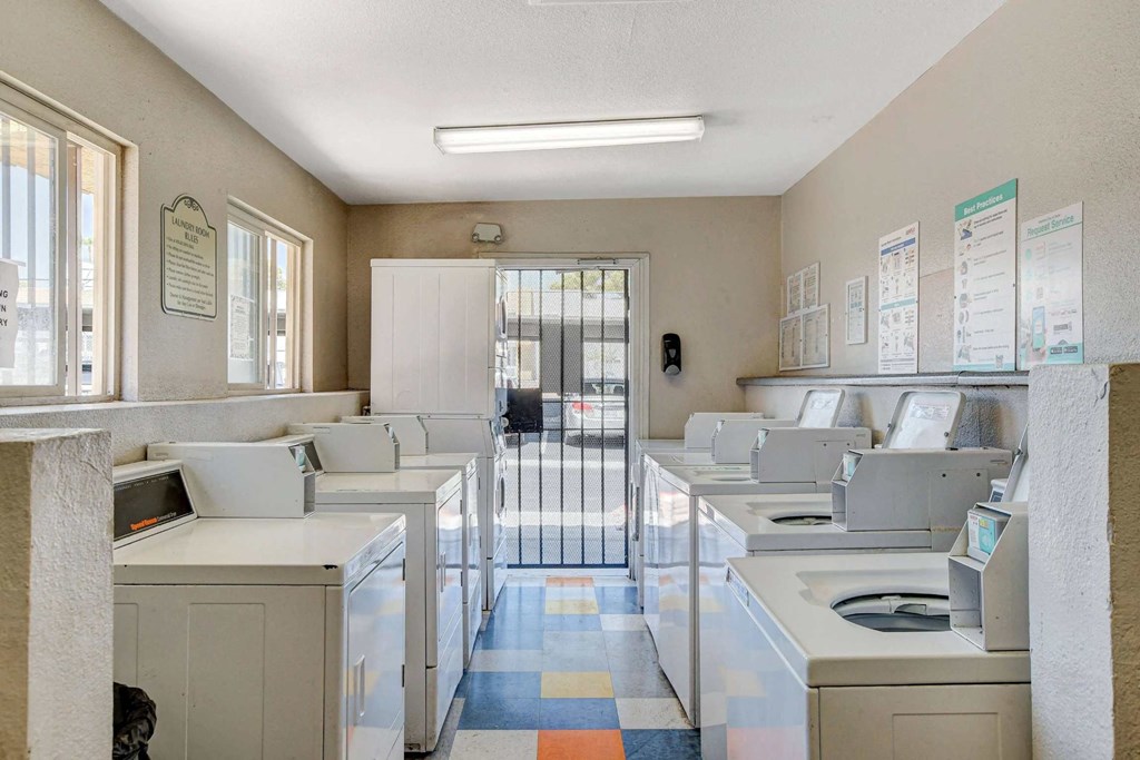 A room with several computers on desks.