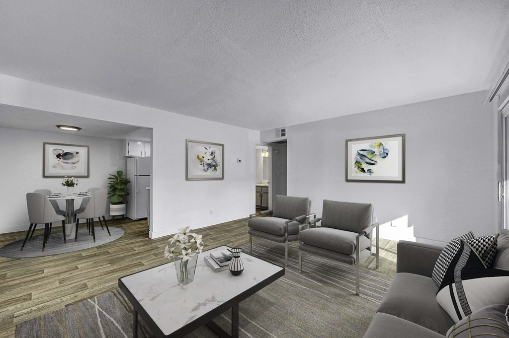 A living room with a grey couch and a coffee table.