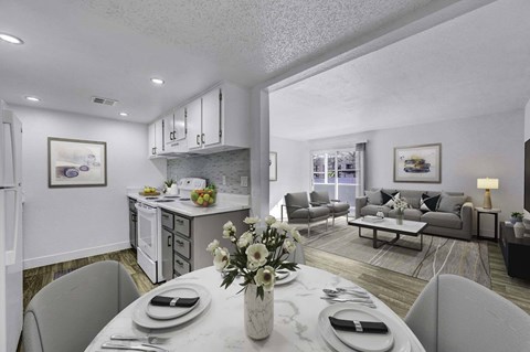A modern dining room with a table set for two.