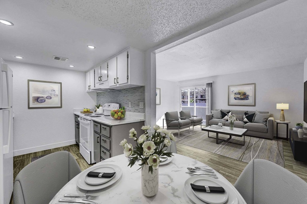 A modern dining room with a table set for two.
