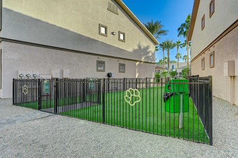 A black metal gate with a white logo on it.