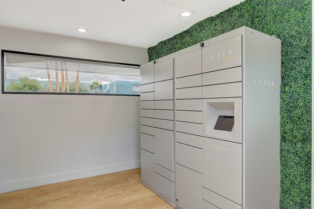 A row of LUXER branded storage units are lined up in a room.