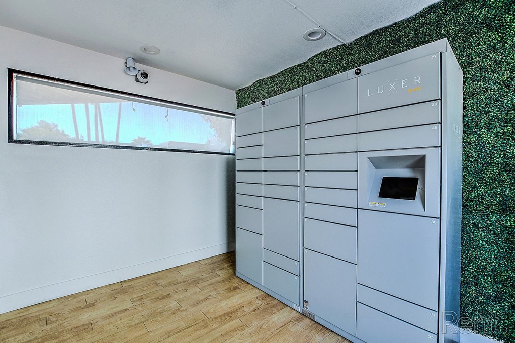 A room with a LUXER sign on a wall.