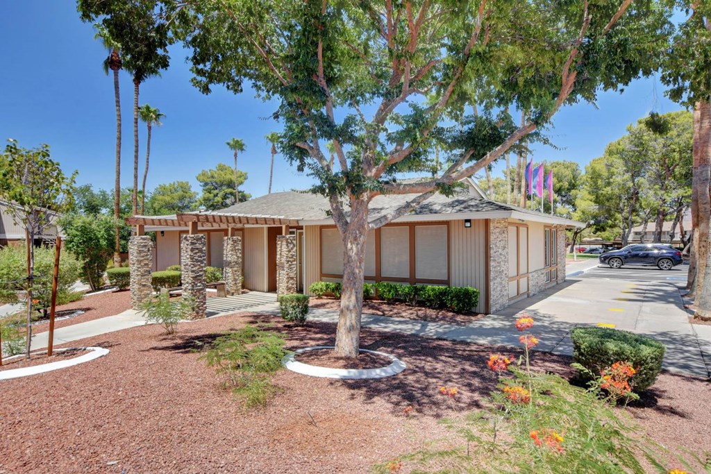A house with a brown roof and a brown fence.