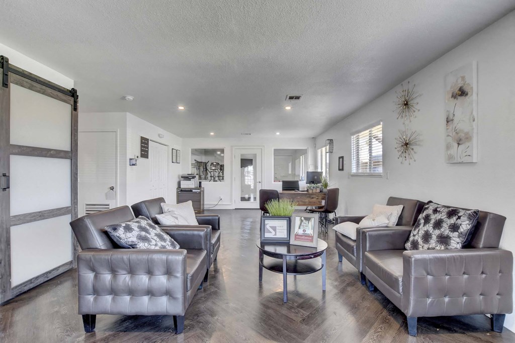 A living room with grey couches and a coffee table.