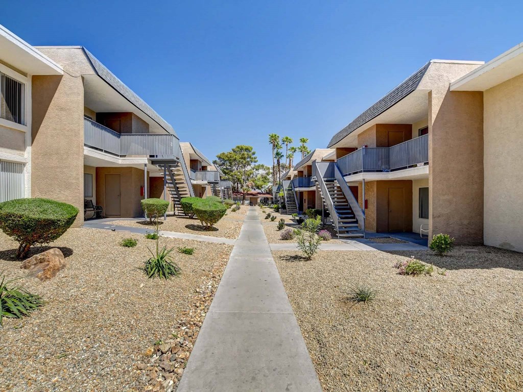 A row of modern houses with balconies and staircases.