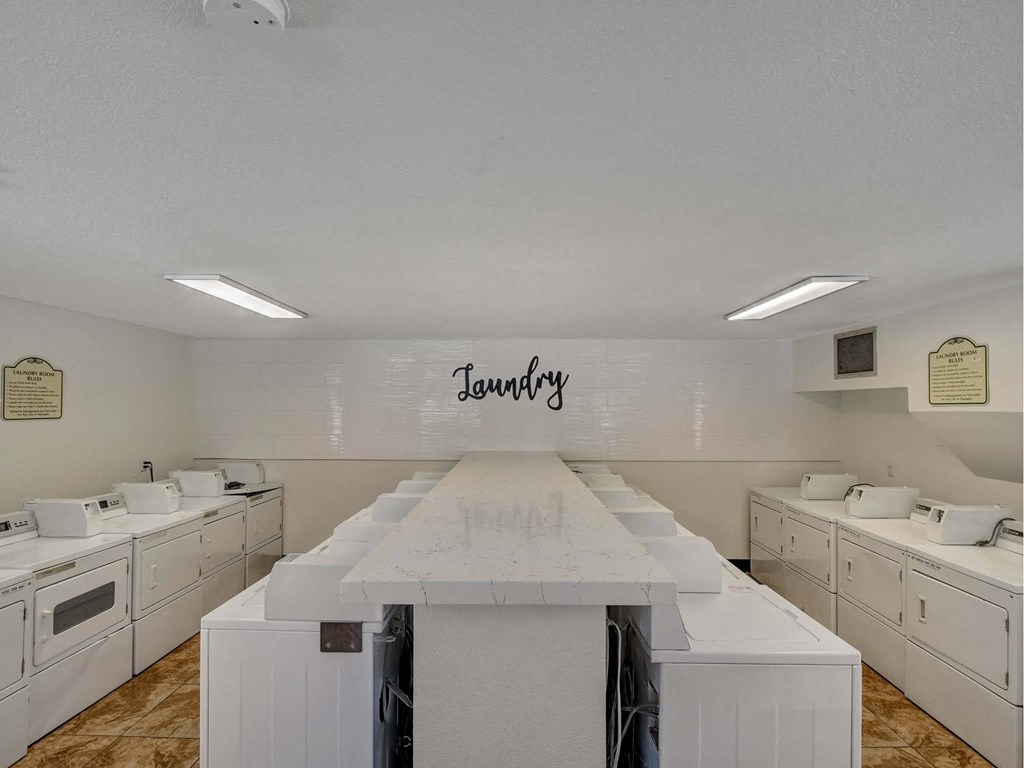 Laundry room with washers and dryers.