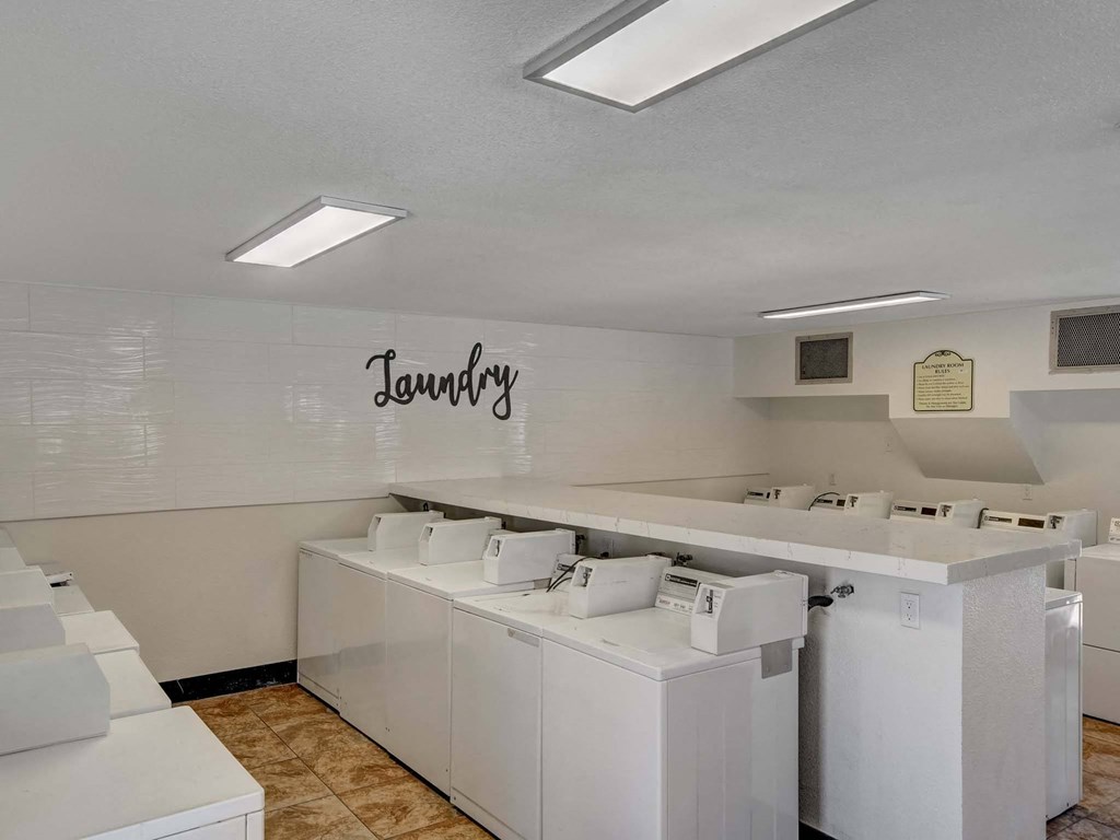 Laundry room with washers and dryers.