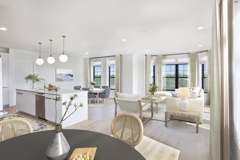 A modern dining room with a table set for four.