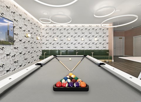 A pool table with a rack of balls in the middle of it.