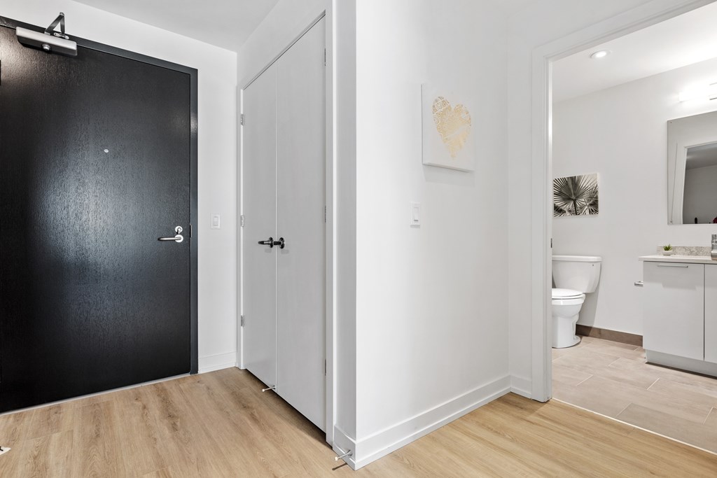 A black door is on the left and a white door is on the right.