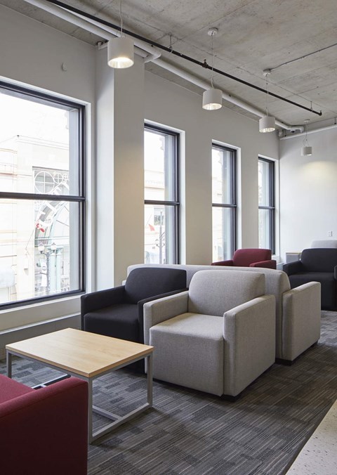 A row of chairs are lined up in a room.