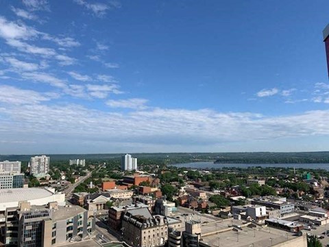 A cityscape with buildings and a clear sky.
