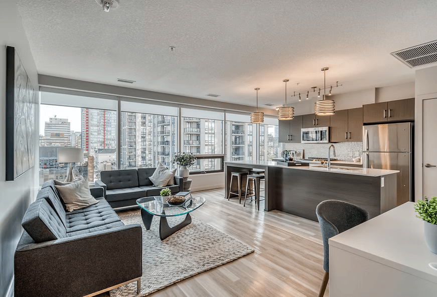 A modern living room with a view of the city.