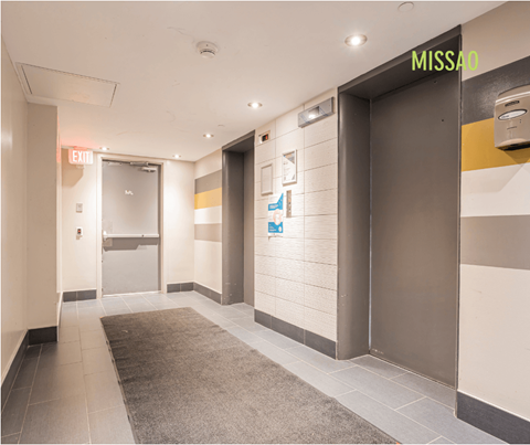 A hallway with a MISSA sign above the door.