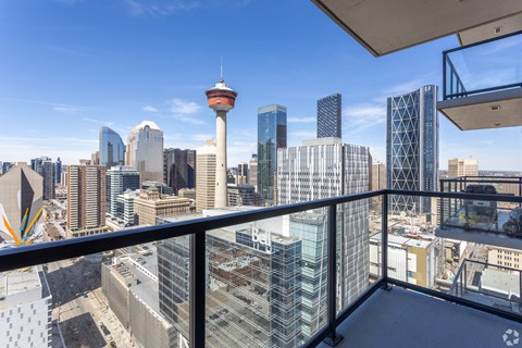 A cityscape with a tall tower in the background.
