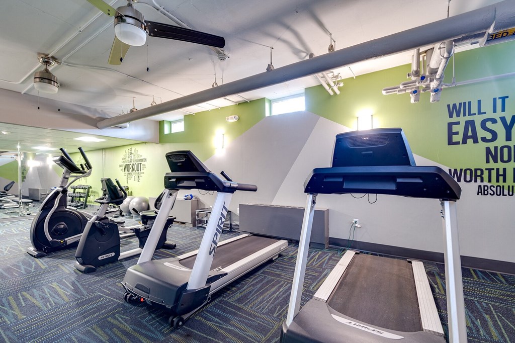 Fitness center with treadmills and elliptical machines at The View at Dayton Towers apartments in Dayton OH.