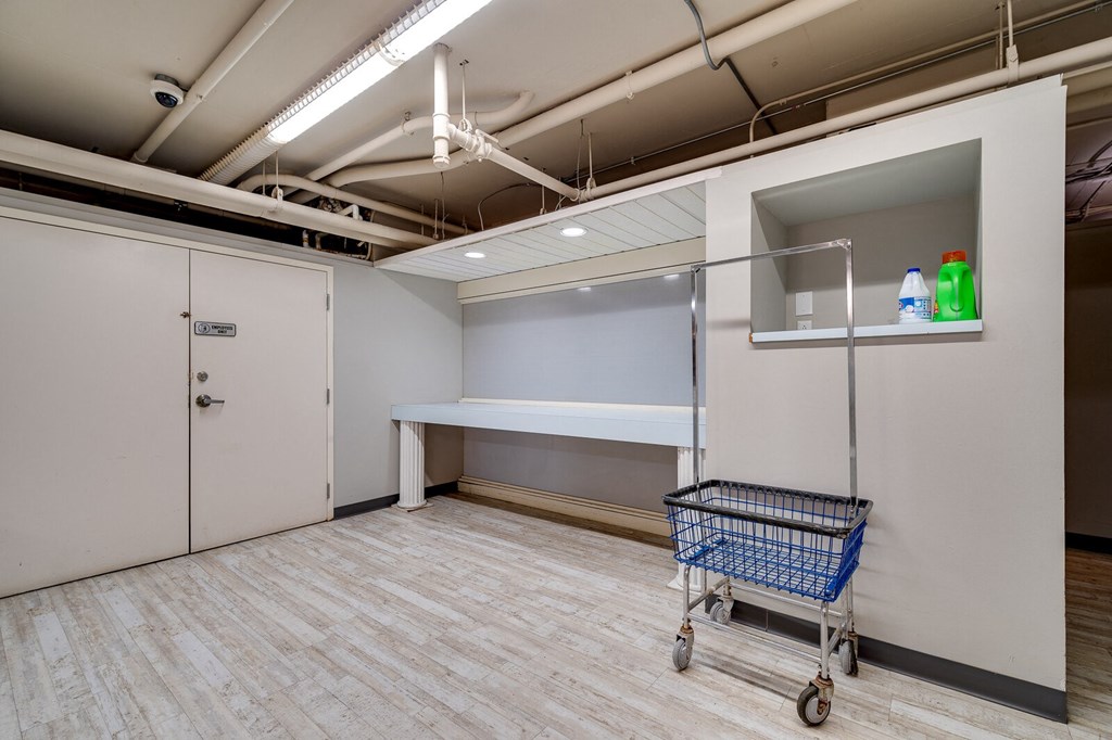 a storage room with a cart in the middle of it