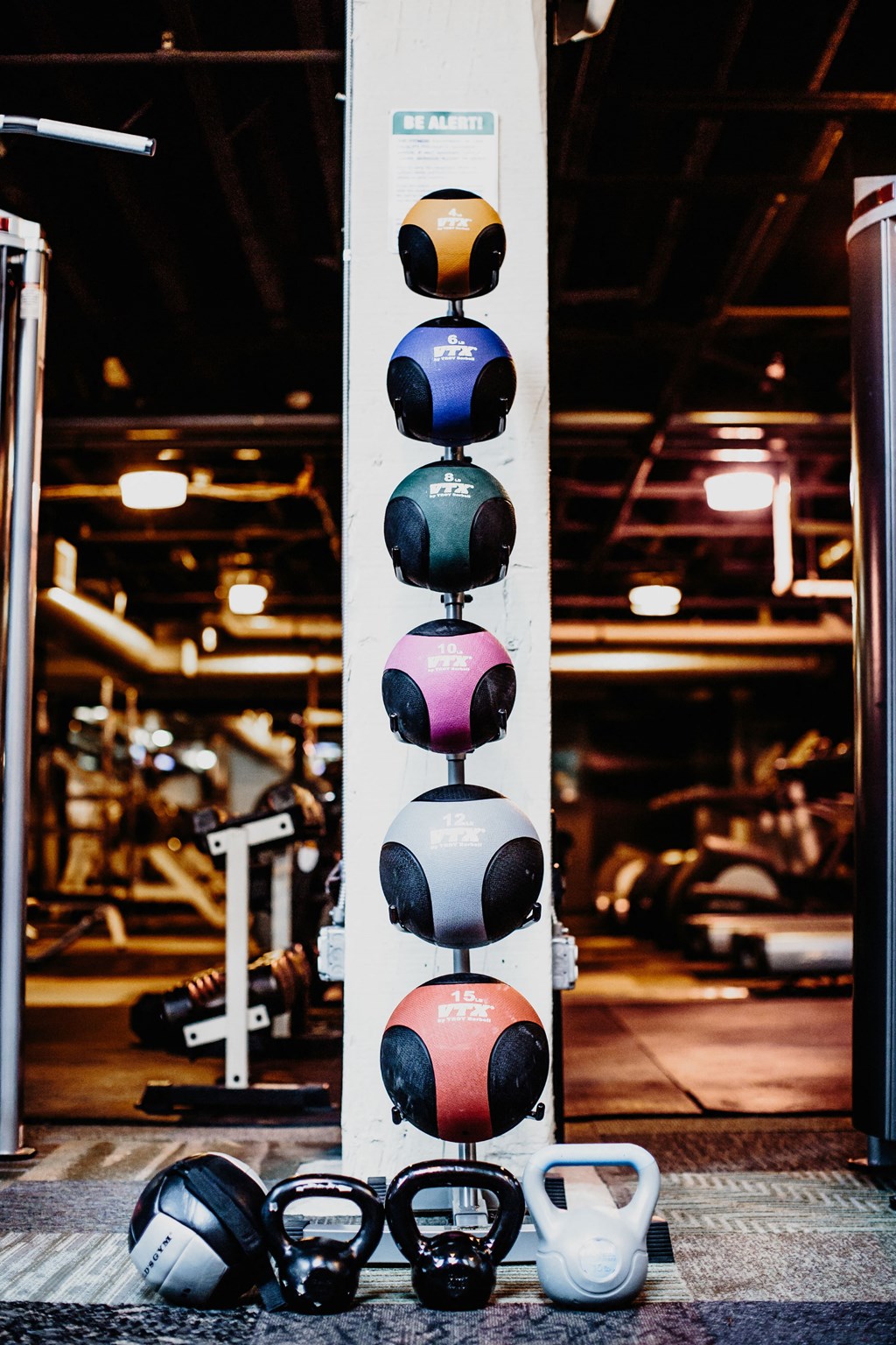 Fitness Center at The Cannery Lofts with a variety of medicine balls and weights