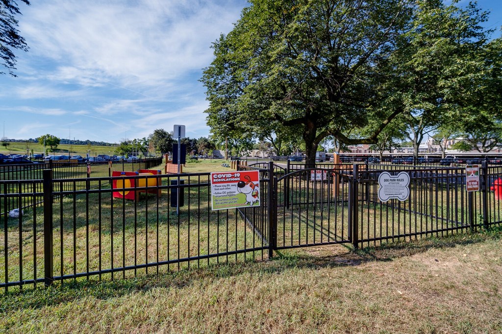 Fenced bark park with obstacle course at Dayton, OH apartments