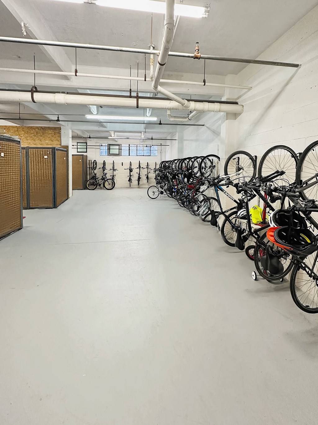 A bike parking area with bikes hung against the wall at St. Clair Lofts in Dayton, OH