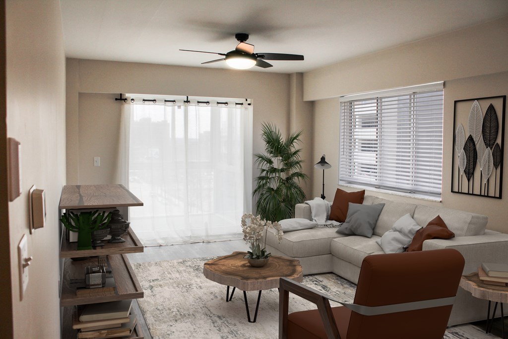 A living room with a brown chair and a white couch.