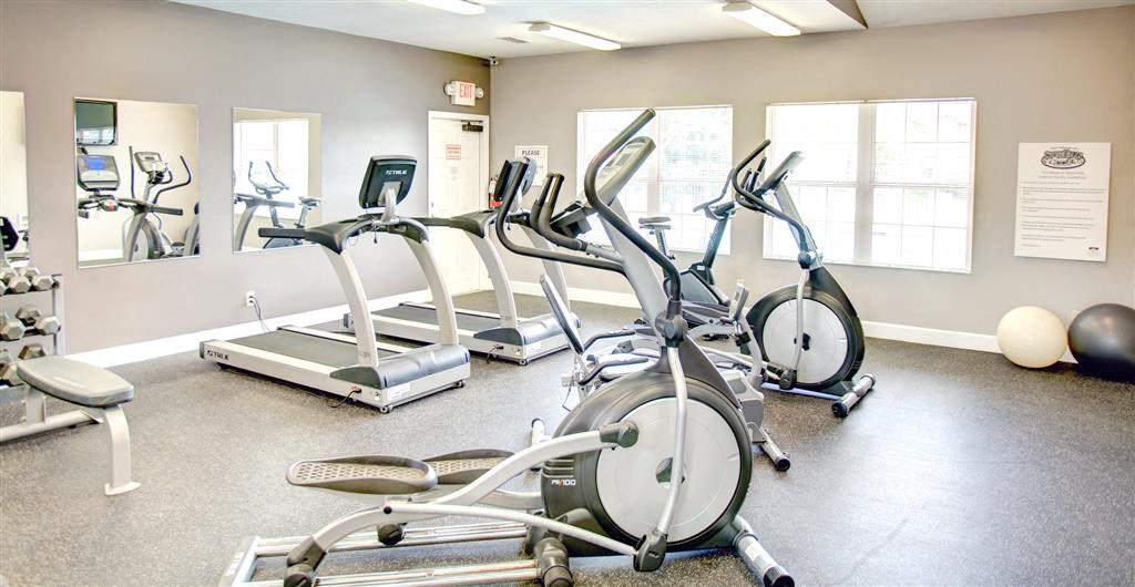 a gym with a lot of exercise equipment