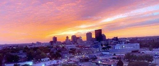 a view of a city skyline at sunset