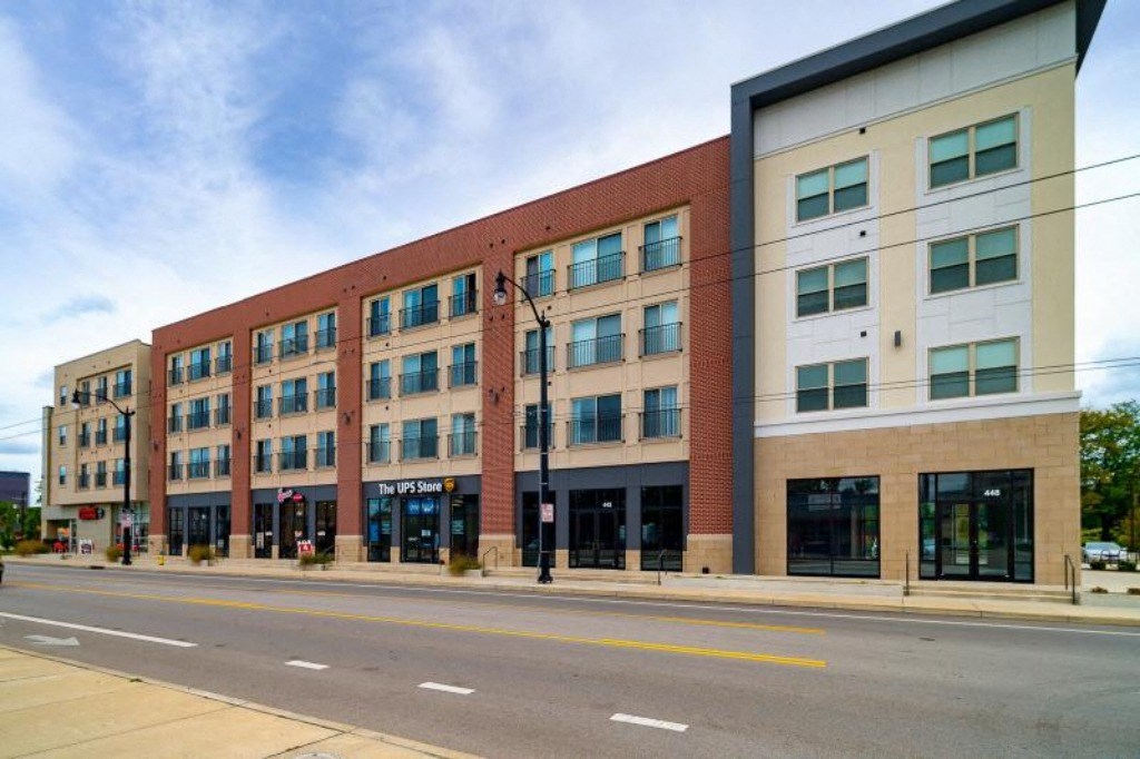 a large brick building on the side of a street