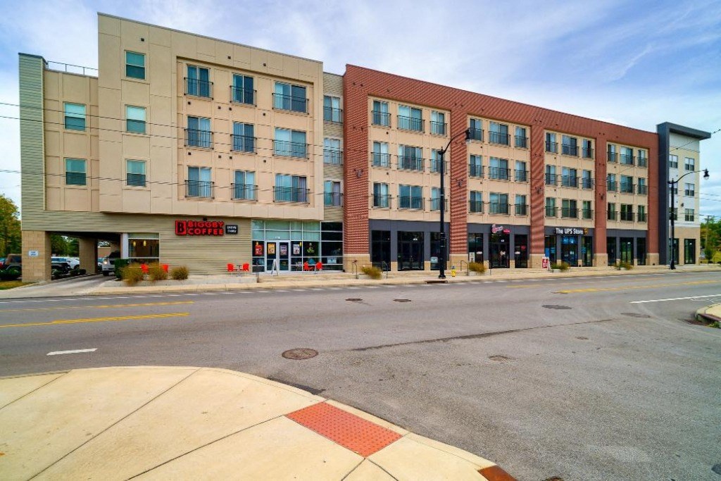 a large building with a street in front of it