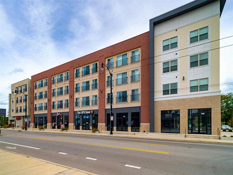 a large brick building on the side of a street