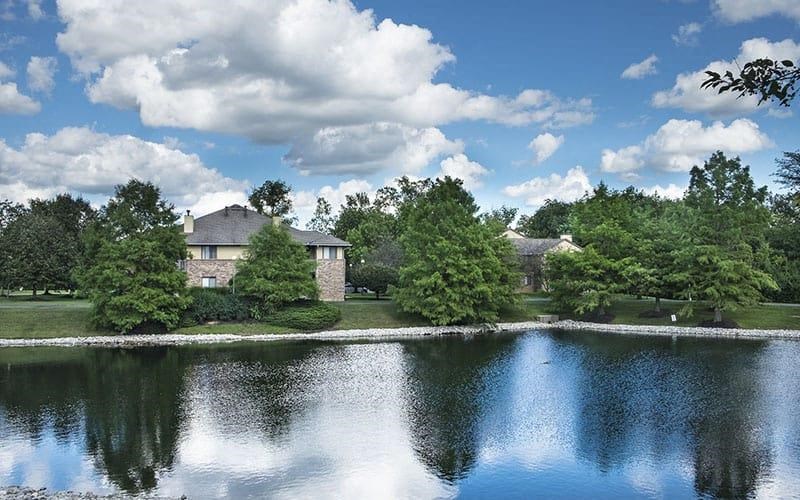 a house on the other side of a lake