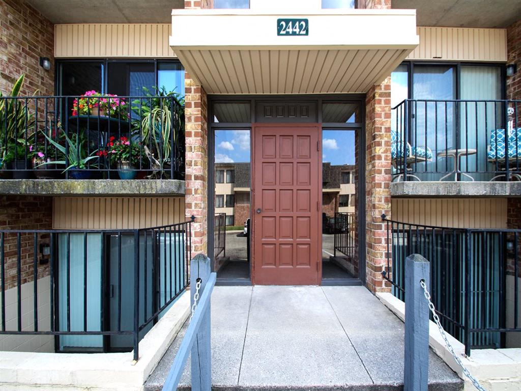the entrance to a building with a red door