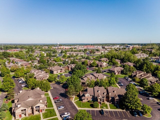 an aerial view of a neighborhood with houses and trees